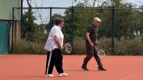 Couple playing walking tennis at The Wimbledon Club